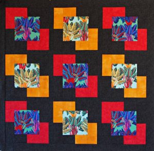 Dominoes quilt pattern in Kaffe Fassett fabrics